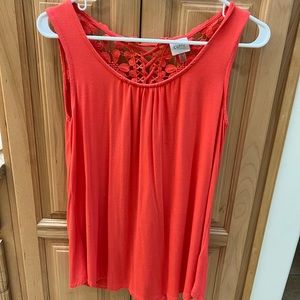 Jersey type coral top. Cut out back